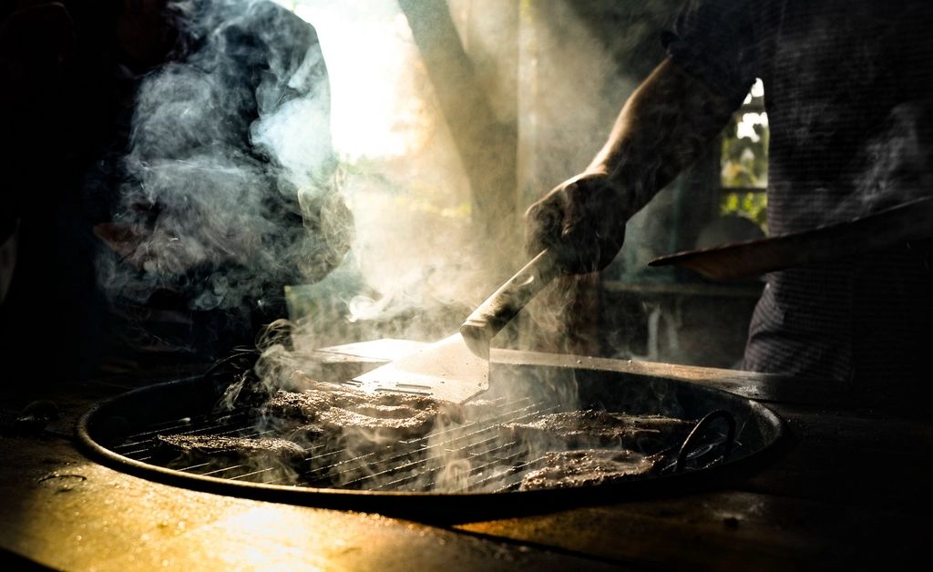 A cook working at the open kitchen