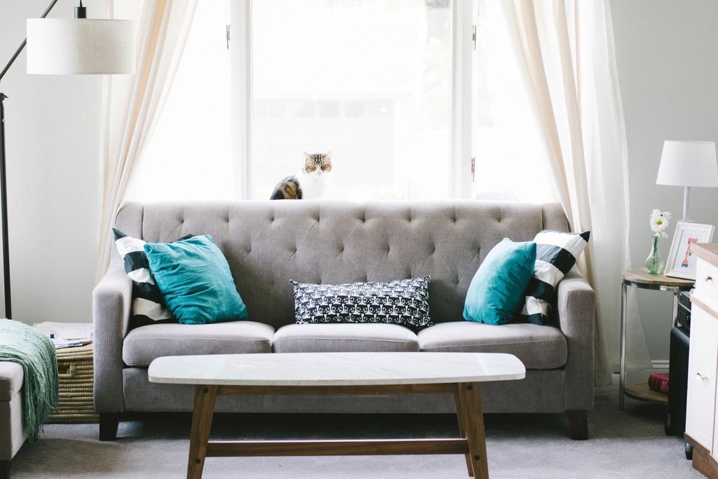 A suite sitting room with a sofa and armchairs